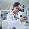 science-microscope-innovation-with-woman-laboratory-medical-research-experiment-healthcare-medicine-young-indian-engineer-working-lab-pharmaceutical-development
